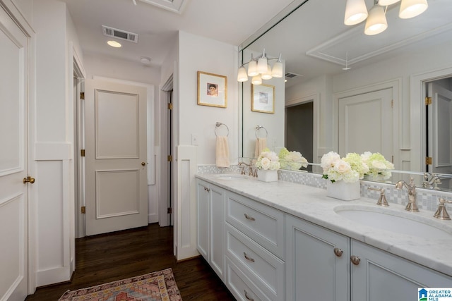 117 Elm St, Mountain Brook, AL 35213 - bathroom featuring double vanity and wood finished floors