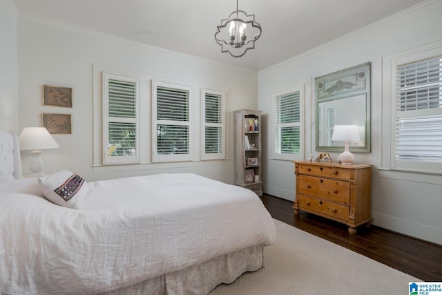 117 Elm St, Mountain Brook, AL 35213 - bedroom with dark wood finished floors, a chandelier, and ornamental molding