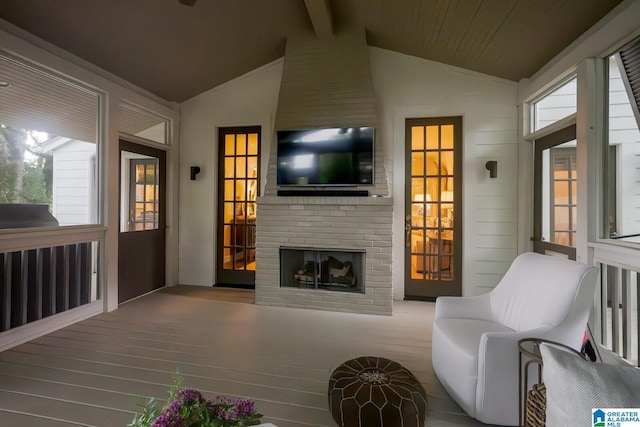 117 Elm St, Mountain Brook, AL 35213 - living area with a brick fireplace and wood finished floors
