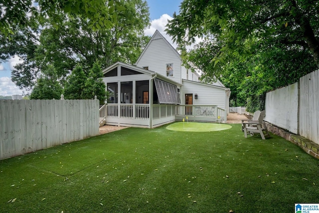 117 Elm St, Mountain Brook, AL 35213 - back of property featuring a sunroom, a putting area, and a fenced backyard