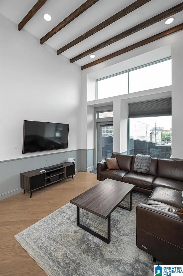 2212 Morris Ave Unit 323, Birmingham, AL 35203 - living area with wood finished floors, beam ceiling, recessed lighting, and a high ceiling