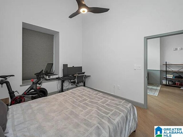 2212 Morris Ave Unit 323, Birmingham, AL 35203 - bedroom with wood finished floors, an office area, and a ceiling fan