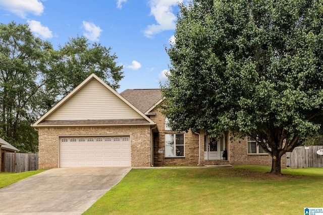 2043 Maplewood Ln, Clanton, AL 35045 - view of front of house featuring concrete driveway, an attached garage, and brick siding