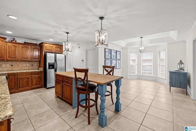 2043 Maplewood Ln, Clanton, AL 35045 - dining room featuring a chandelier, light tile patterned floors, recessed lighting, and a raised ceiling