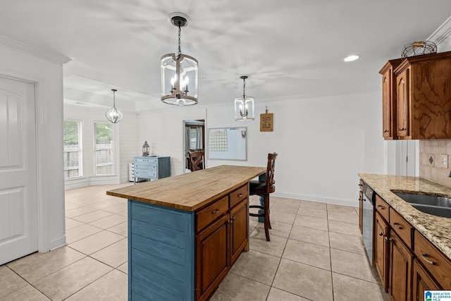 2043 Maplewood Ln, Clanton, AL 35045 - kitchen featuring a chandelier, wooden counters, light tile patterned floors, tasteful backsplash, and recessed lighting