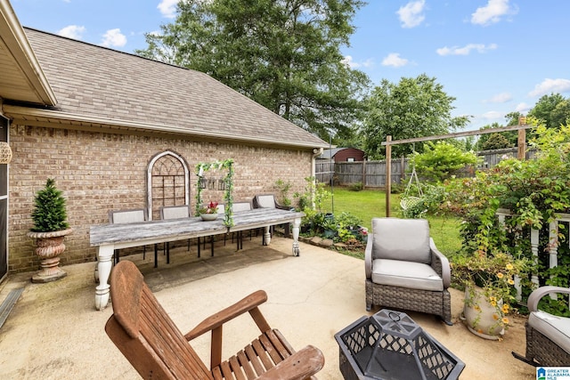 2043 Maplewood Ln, Clanton, AL 35045 - fenced backyard featuring a patio area and outdoor dining space