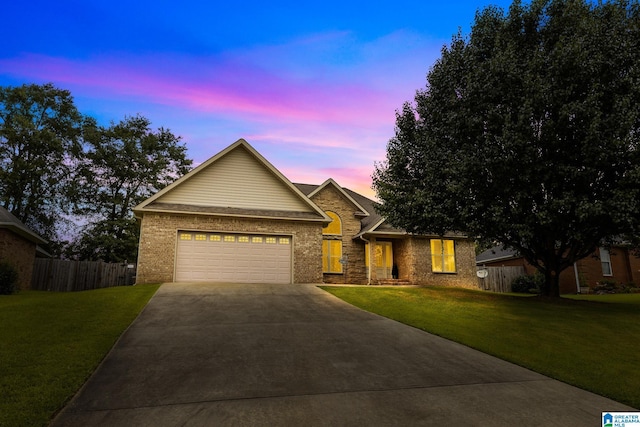 2043 Maplewood Ln, Clanton, AL 35045 - view of front of home with driveway, an attached garage, and brick siding