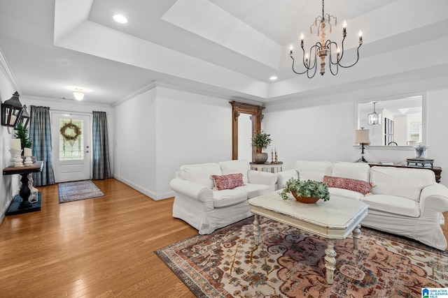 2043 Maplewood Ln, Clanton, AL 35045 - living area featuring a raised ceiling, light wood-style floors, a chandelier, recessed lighting, and ornamental molding