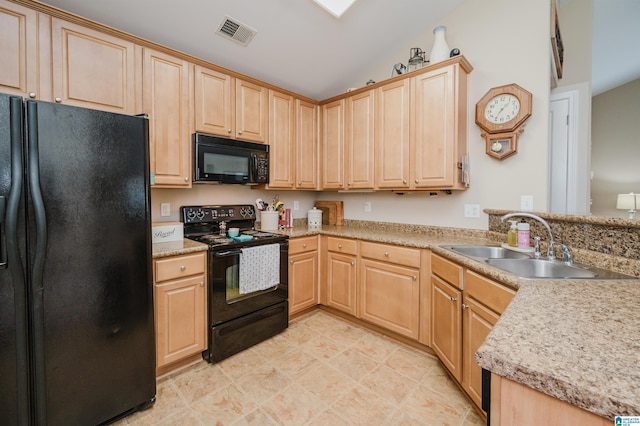 4033 Cambridge Dr, Moody, AL 35004 - kitchen featuring black appliances, light brown cabinetry, a peninsula, and light countertops