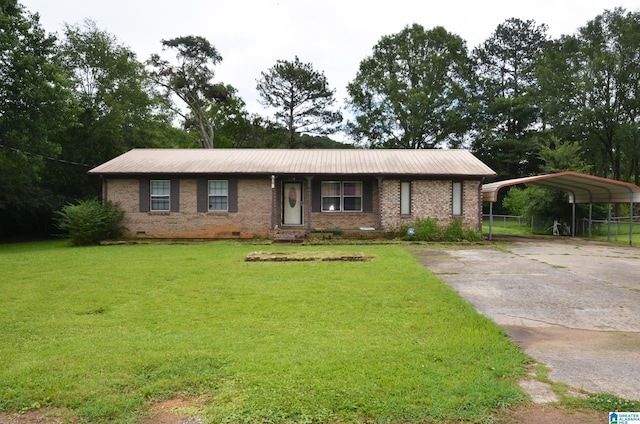 6301 Cedar Ct, Anniston, AL 36206 - view of front facade with crawl space, a detached carport, brick siding, and concrete driveway