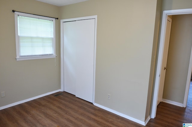 6301 Cedar Ct, Anniston, AL 36206 - unfurnished bedroom featuring dark wood-type flooring and a closet