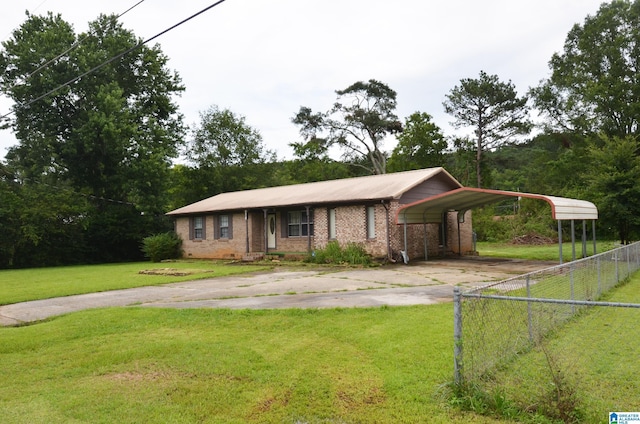 6301 Cedar Ct, Anniston, AL 36206 - view of front facade featuring driveway, a detached carport, and brick siding