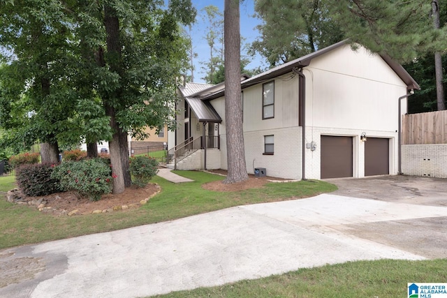 1025 Old Section Rd, Hoover, AL 35244 - view of front facade featuring driveway, an attached garage, and brick siding