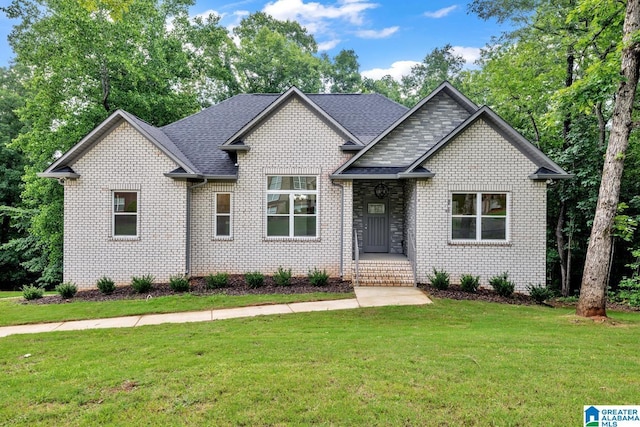7945 Forest Loop, Pinson, AL 35126 - craftsman inspired home with a front lawn, brick siding, and a shingled roof