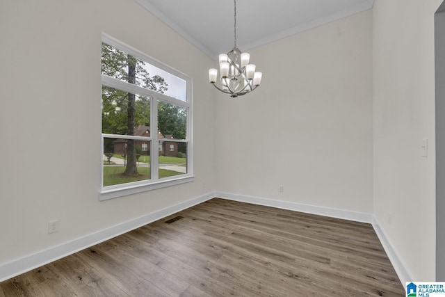 7945 Forest Loop, Pinson, AL 35126 - empty room featuring a chandelier, crown molding, and wood finished floors