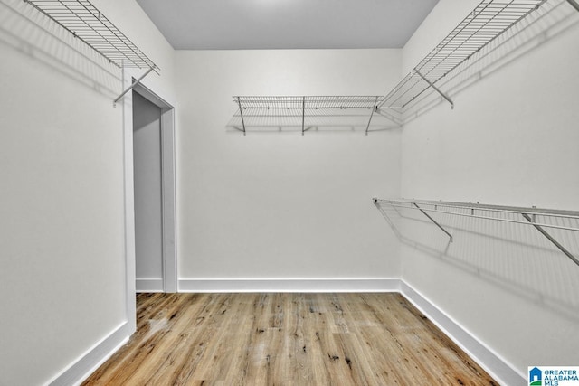 7945 Forest Loop, Pinson, AL 35126 - spacious closet featuring wood finished floors