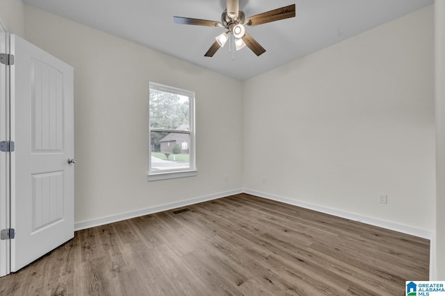 7945 Forest Loop, Pinson, AL 35126 - empty room with wood finished floors and a ceiling fan