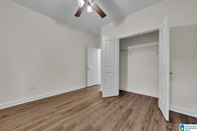 7945 Forest Loop, Pinson, AL 35126 - unfurnished bedroom featuring a closet, wood finished floors, and ceiling fan