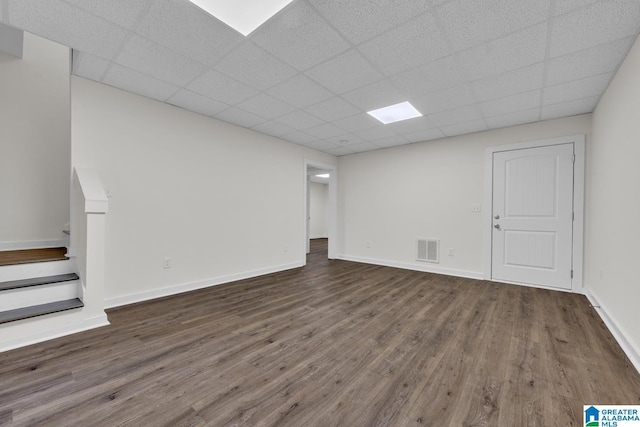 7945 Forest Loop, Pinson, AL 35126 - below grade area featuring wood finished floors, a drop ceiling, and stairs