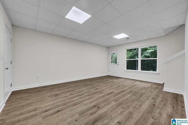 7945 Forest Loop, Pinson, AL 35126 - empty room with wood finished floors and a paneled ceiling