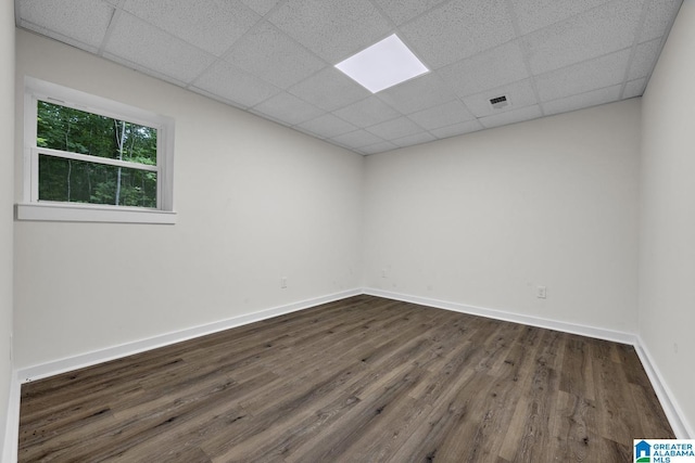 7945 Forest Loop, Pinson, AL 35126 - unfurnished room featuring a drop ceiling and dark wood-style floors