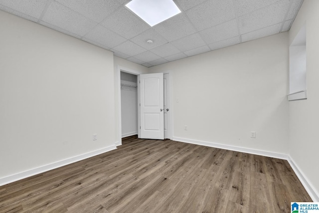 7945 Forest Loop, Pinson, AL 35126 - unfurnished bedroom featuring wood finished floors, a paneled ceiling, and a closet