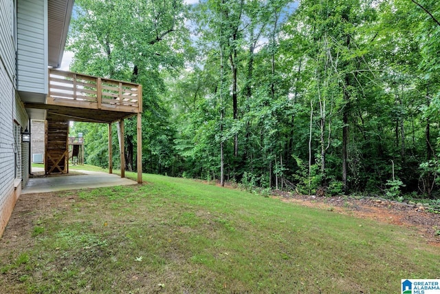 7945 Forest Loop, Pinson, AL 35126 - view of grassy yard with a patio area, a deck, stairs, and a forest view