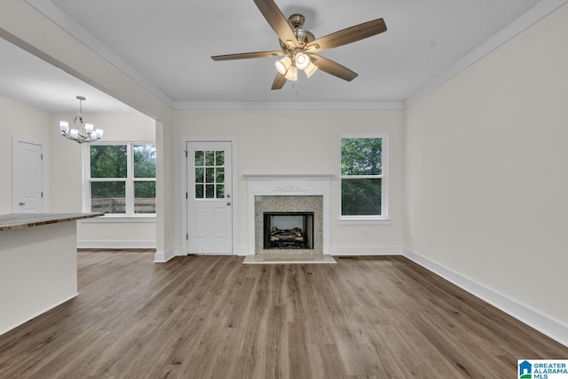 7945 Forest Loop, Pinson, AL 35126 - unfurnished living room with a chandelier, ceiling fan, wood finished floors, a fireplace, and ornamental molding