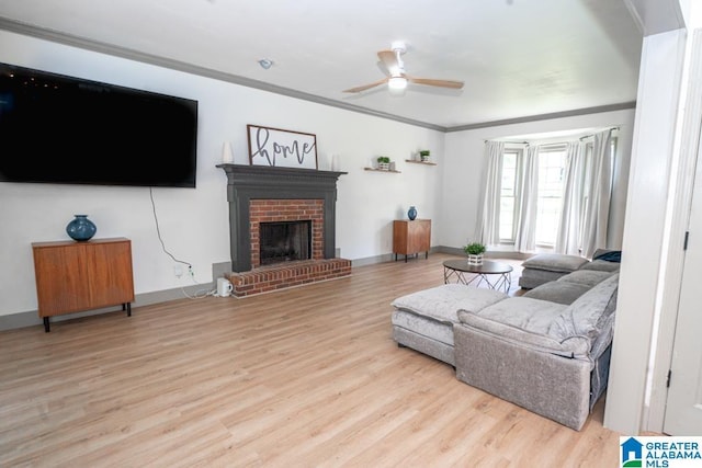 1004 Broken Bow Trl, Alabaster, AL 35007 - living room with ornamental molding, ceiling fan, wood finished floors, and a brick fireplace