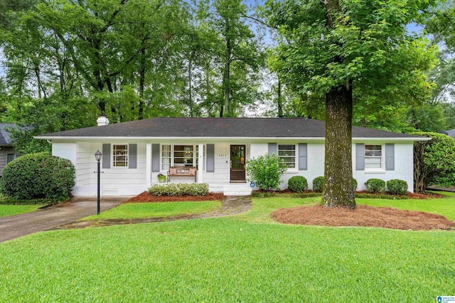 4317 Warren Rd, Birmingham, AL 35213 - single story home with a porch, a front yard, a chimney, and driveway