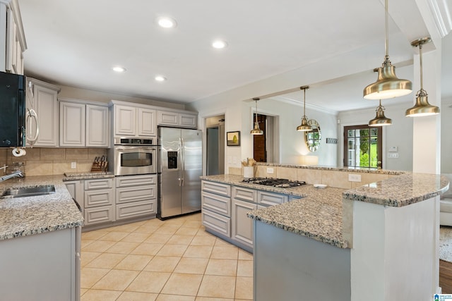 4317 Warren Rd, Birmingham, AL 35213 - kitchen featuring appliances with stainless steel finishes, decorative backsplash, light stone counters, recessed lighting, and light tile patterned floors