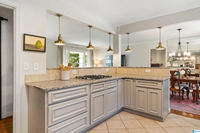 4317 Warren Rd, Birmingham, AL 35213 - kitchen featuring backsplash, light tile patterned flooring, light stone countertops, stainless steel gas stovetop, and ornamental molding