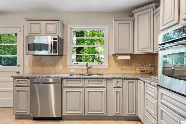 4317 Warren Rd, Birmingham, AL 35213 - kitchen featuring appliances with stainless steel finishes, plenty of natural light, and backsplash