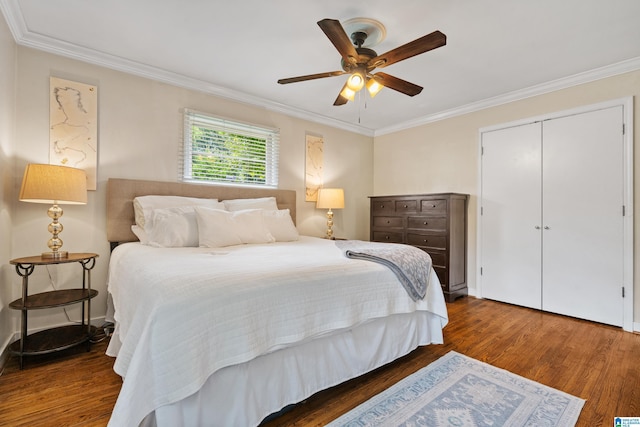 4317 Warren Rd, Birmingham, AL 35213 - bedroom featuring crown molding, wood finished floors, a ceiling fan, and a closet