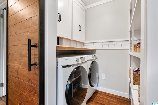4317 Warren Rd, Birmingham, AL 35213 - laundry area with washing machine and dryer, cabinet space, and wood finished floors