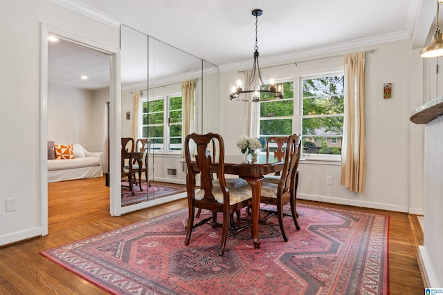 4317 Warren Rd, Birmingham, AL 35213 - dining room featuring a chandelier, ornamental molding, and wood finished floors