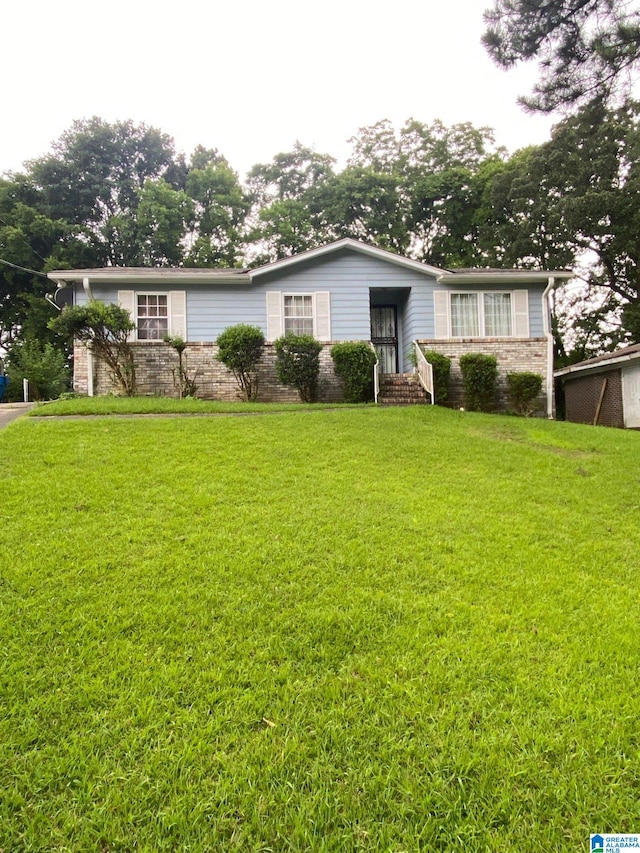 1545 Carol Cir, Midfield, AL 35228 - view of front facade with stone siding and a front yard