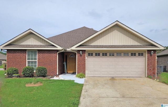 955 Clover Ave, Odenville, AL 35120 - ranch-style home with a garage, concrete driveway, brick siding, a front lawn, and roof with shingles