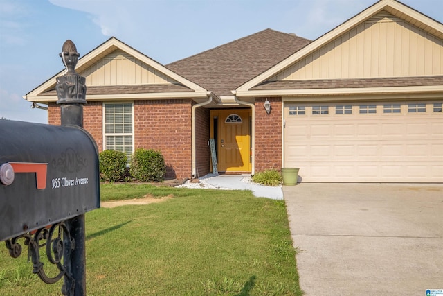 955 Clover Ave, Odenville, AL 35120 - view of front facade with brick siding, a front yard, a garage, roof with shingles, and board and batten siding