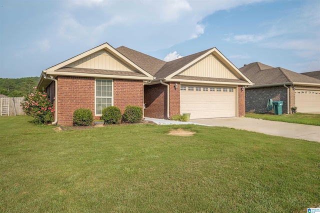 955 Clover Ave, Odenville, AL 35120 - view of front of property featuring a garage, driveway, a front yard, and brick siding