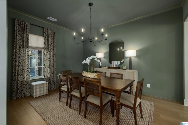 1313 Severn Way, Hoover, AL 35244 - dining space featuring ornamental molding, light wood-style floors, and a chandelier