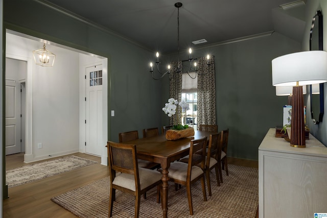 1313 Severn Way, Hoover, AL 35244 - dining room with a chandelier, wood finished floors, and ornamental molding