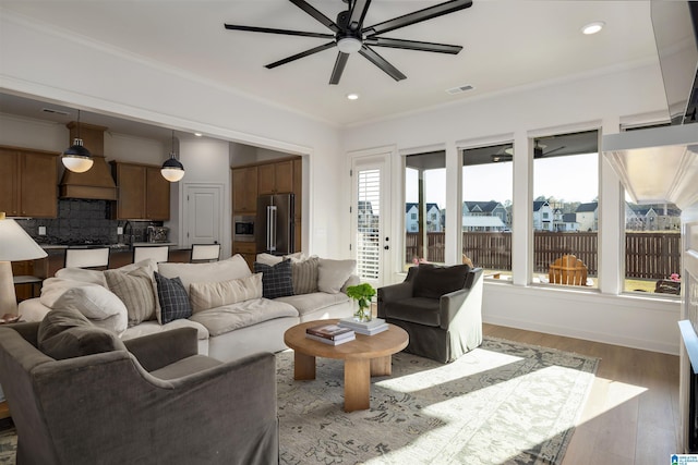 1313 Severn Way, Hoover, AL 35244 - living room with a ceiling fan, ornamental molding, light wood-style flooring, and recessed lighting