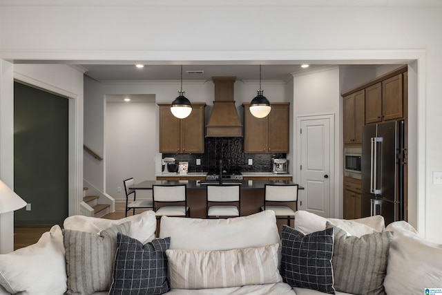 1313 Severn Way, Hoover, AL 35244 - kitchen with appliances with stainless steel finishes, open floor plan, custom exhaust hood, decorative backsplash, and crown molding