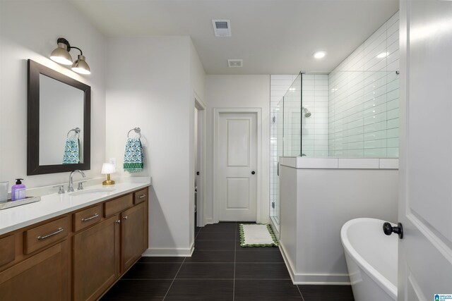 1313 Severn Way, Hoover, AL 35244 - bathroom with tile patterned floors, a stall shower, a soaking tub, vanity, and recessed lighting
