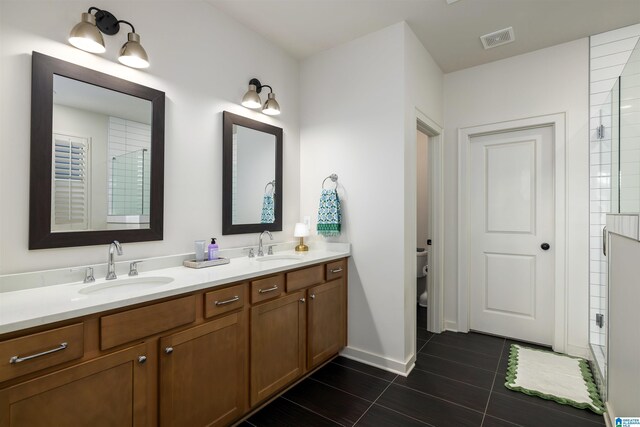 1313 Severn Way, Hoover, AL 35244 - bathroom featuring double vanity and tiled shower