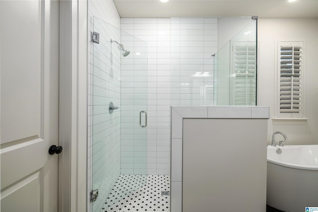 1313 Severn Way, Hoover, AL 35244 - bathroom featuring a stall shower and a soaking tub