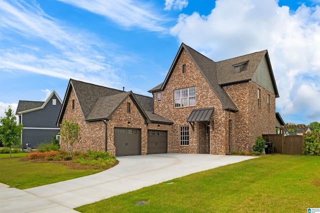 1313 Severn Way, Hoover, AL 35244 - tudor house with brick siding, concrete driveway, an attached garage, and roof with shingles