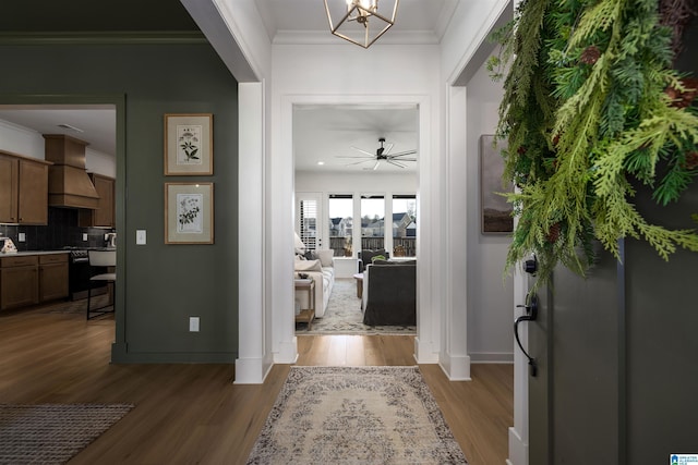 1313 Severn Way, Hoover, AL 35244 - foyer featuring wood finished floors, crown molding, a chandelier, and ceiling fan