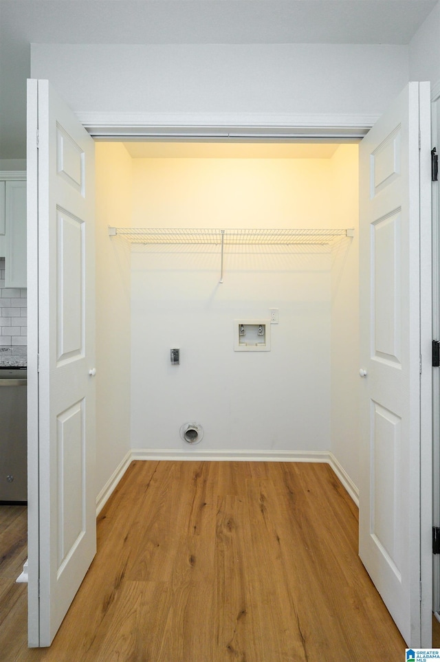 4022 Cambridge Dr, Moody, AL 35004 - washroom featuring washer hookup, hookup for an electric dryer, and light wood-style flooring